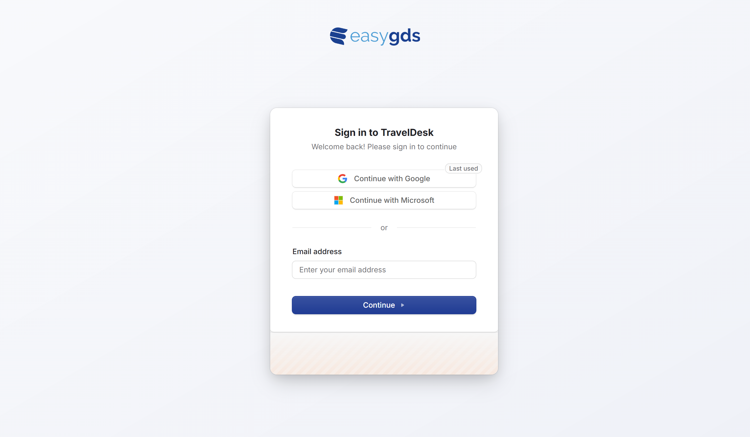 The TravelDesk sign-in screen with SSO and email options.